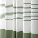 The premium imported textured fabric curtain paired with bathroom accessories showing real light filtration properties.