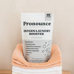 Eco friendly laundry room setup with Pronounce 60 loads oxygen booster bag.