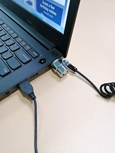 LORADAR portable keyed laptop lock kit components unboxed including adhesive plate and steel cable.
