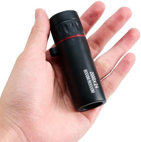 Spa Luxetique 2000x24 monocular telescope demonstrating its portable lightweight travel size next to outdoor gear.