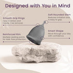 Reusable period cup kit showing two gray cups and a protective case.