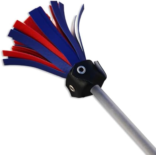 Young beginner kid holding the lightweight black juggling sticks showing the appropriate size for smaller hands