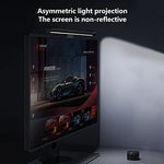Diirglus e-reading LED hanging light casting asymmetric illumination downwards onto a desk workspace layout