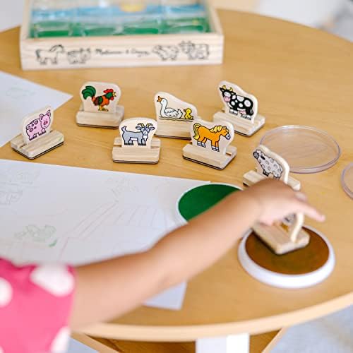 Detailed view of wooden farm animal stamps with easy grip handles