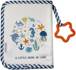 Close up view of the star shaped teething pendant attached to the HarvMax fabric photo album.