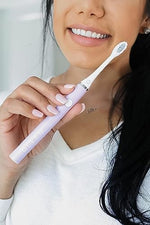 Gleem lavender electric toothbrush packed inside its sleek matching travel case