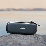Anker protective travel pouch showing internal mesh pocket holding charging cables
