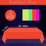 Fluorescent table covers glowing under blacklight with star patterns
