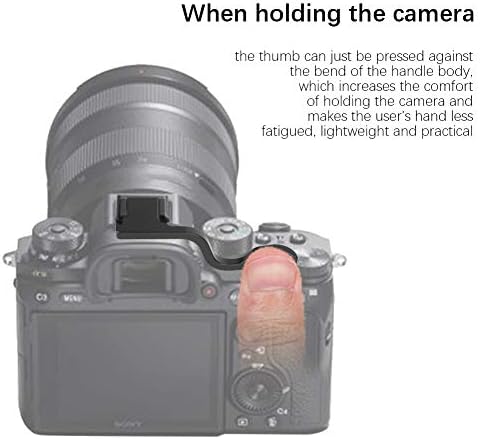 Ergonomic camera thumb rest mounted on a mirrorless camera hot shoe illustrating single-handed grip comfort.