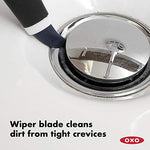 Close up view of the small detailing brush highlighting the pointed nylon bristles and built-in wiper blade
