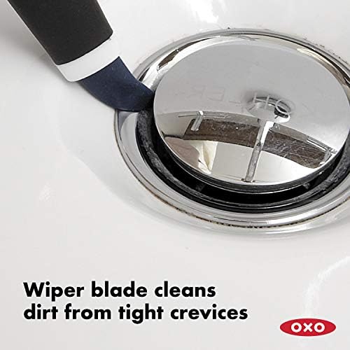 Close up view of the small detailing brush highlighting the pointed nylon bristles and built-in wiper blade