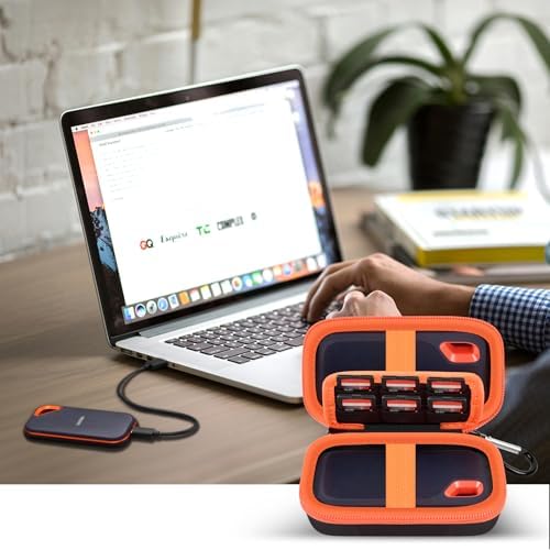 COMECASE orange hard drive storage container clipped onto a traveler backpack using the included durable carabiner hook