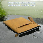 Homakover book sleeve being held by the handle strap