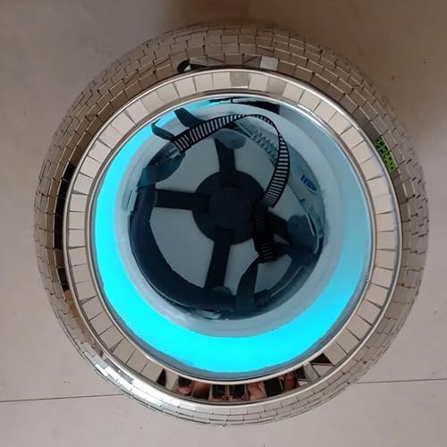 Three quarter view of the FXiaoy mirror ball headgear reflecting ambient nightclub lights.