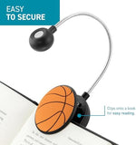 Withit portable LED reading light attached to a book