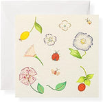Premium three inch square book fold enclosure cards with transparent vellum envelopes laid out beautifully