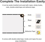 Installation accessories including hooks and ropes attached to a wall.