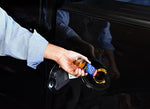 Gumout Regane fuel additive bottle showing engine deposit cleaner highlights.