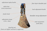Adjustable child sling carrier demonstrating full strap extension range.