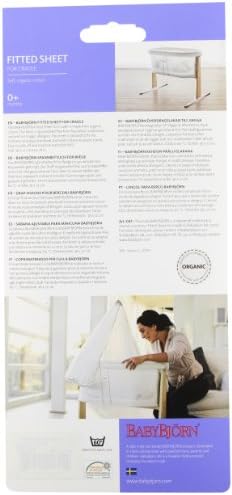 Organic white baby crib sheet highlighting the elasticated edge design.
