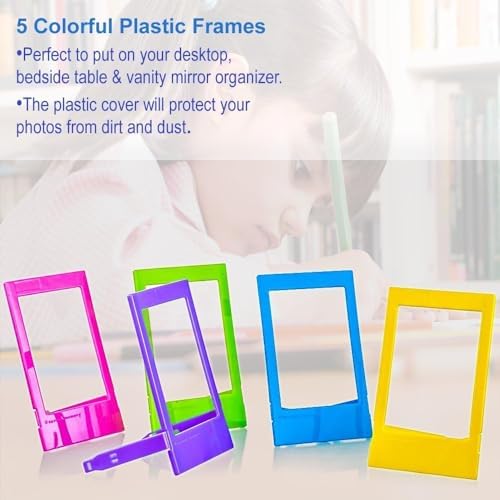 Hanging paper frames with colorful wooden mini clips and string for room decoration.