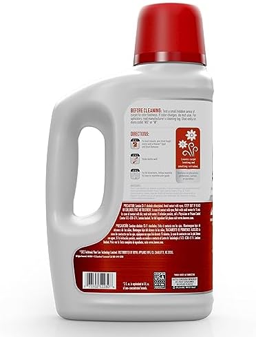 Hoover 2X concentrated carpet shampoo bottle showing Fresh Meadows scent label.