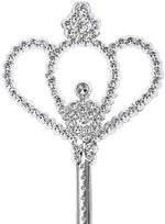 Child holding silver fairy wand during pretend play