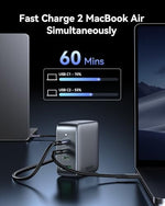 Imokin compact Gallium Nitride charger plug next to a premium ultrabook laptop