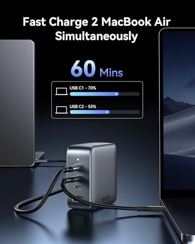 Imokin compact Gallium Nitride charger plug next to a premium ultrabook laptop