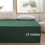 Dark green twin sheet neatly fitted on a mattress