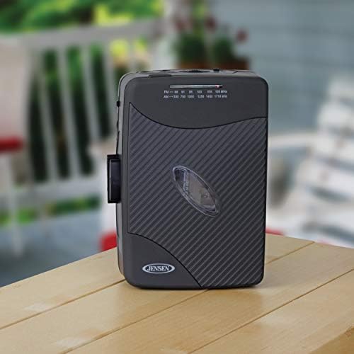 Jensen portable radio and cassette player package showing included stereo earbuds and belt clip.