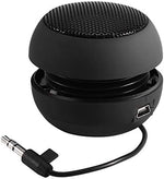 Ciciglow portable travel speaker alongside the included black USB charging cable