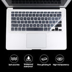 Close up view of transparent protective film reducing sound on notebook keyboard keys