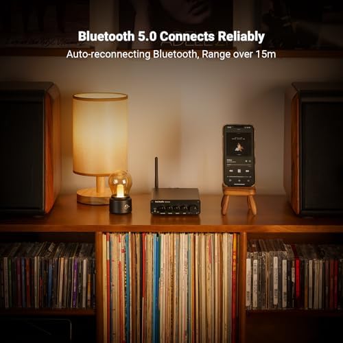 Fosi Audio 2.1 channel home audio amplifier alongside bookshelf speakers in a modern setup.