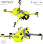 Close up view of the bottom and battery section of a drone wrapped in WRAPGRADE Neon Yellow accent skin