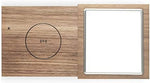 Side profile of the compact Tivoli Audio Revive device highlighting the seamless blend of wood and fabric texture.