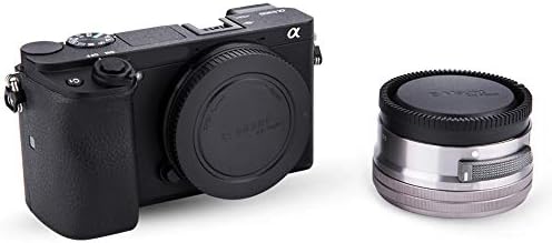 Hot shoe cover sliding into a mirrorless camera top mount for oxidation defense