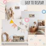 Premium wooden baby sonogram frame being held as a gender reveal party announcement prop