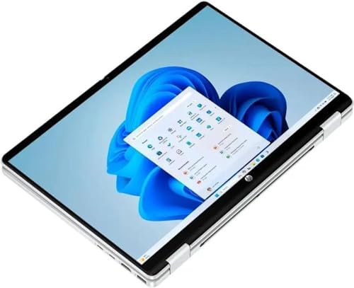 HP convertible silver laptop rotated into tent mode displaying Windows 11 Pro user interface.