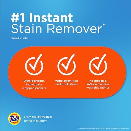 Bleach free Tide stain remover wipes being used on fabric