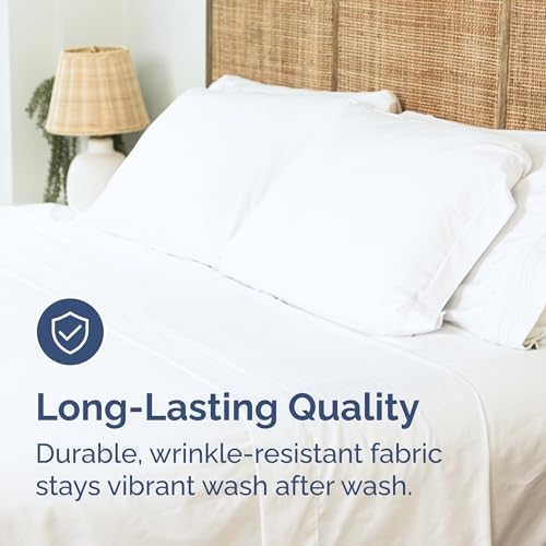 Wrinkle free and fade resistant white flat bedding sheet spread smoothly on a bed.