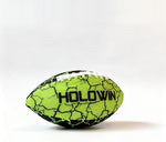 Junior size waterproof football floating on clear blue swimming pool water during a summer party.
