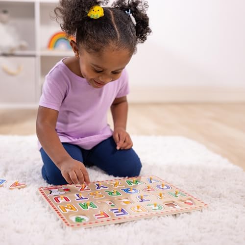 Toddler learning toy showcasing hidden pictures printed under the removable wooden alphabet letters