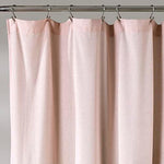Lush Decor fabric shower curtain in blush pink and off white showing its full drape.