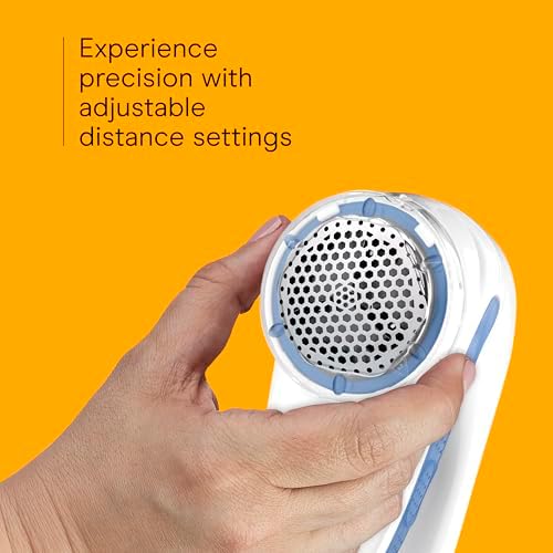 Close up of the detachable lint catcher on the Conair portable fabric shaver.