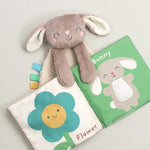 Itzy Ritzy learn and snuggle gift set displayed on an aesthetic nursery background