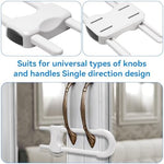 White child safety cabinet locks installed on kitchen knobs