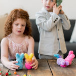 Peeps bunny plush being held in hand to show scale