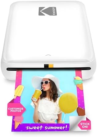 Kodak portable smartphone printer printing a vibrant two by three inch color photo.