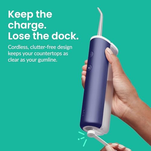The Midnight Blue Quip water flosser showing the two pressure mode indicator lights.